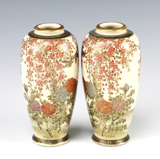 A pair of Japanese Satsuma porcelain vases decorated birds amidst branches, the base with seal mark 12cm 