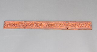 A cast iron railway sign "Penalty for Not Shutting Gate 2 pounds" 7.5cm h x 77cm w 