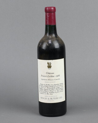 A bottle of 1966 Chateau Prieure-Lichine red wine, shipped and bottle by Hedges and Butler (low on neck)