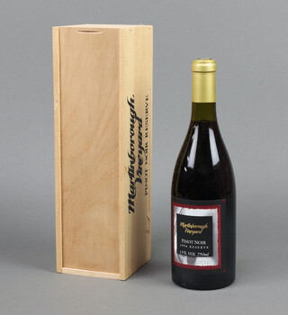 A bottle of 1994 reserve Martinborough Vineyard Pinot Noir, contained in a wooden box  