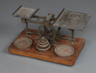 Samson Morden, a large pair of 19th Century brass letter scales complete with weights on an oak base 20cm h x 38cm w x 22cm d 