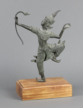 A Thai bronze figure of a standing archer raised on a wooden base 30cm h x 23cm 