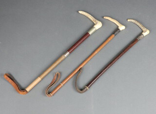 Three hunting crops with stag horn handles 