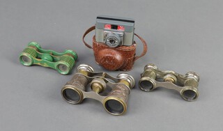 A Homer no.1 spy camera with leather case, pair of opera glasses decorated a stag hunt, pair of gilt metal opera glasses and a pair of green enamelled ditto (a/f) 