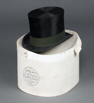 Henry Heath, a gentleman's black top hat size 6 3/4  contained in a Lock & Co cardboard hat box 