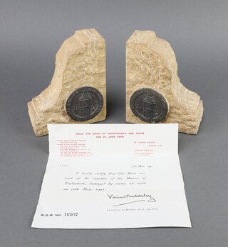 A pair of sandstone and lead book ends formed from a section of the bomb damaged Houses of Parliament together with certificate dated May 1942 