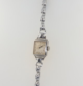 A lady's 1930's steel cased Omega wristwatch on a later chromium bracelet 