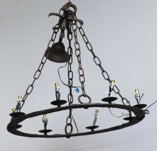 A circular wrought iron 8 light electrolier 63cm diam. 