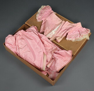 A Georgian style long pink dress comprising bustier, underskirt and sash, contained in a Maxwell and Company cardboard box  