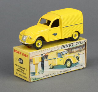 French Dinky Toys , a Citroen 2CV Postale Van 560 with  yellow body and hubs, blue swallow decals to door and original picture box (not Triang)