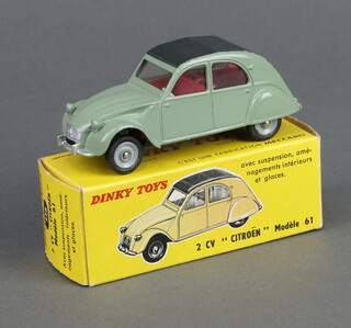 French Dinky Toys, a Citroen 2CV 558 in green with back roof, with original picture box 