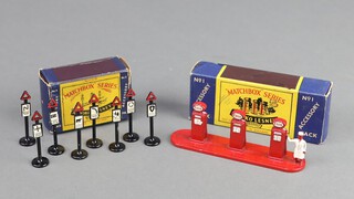 Moko Lesney, a Matchbox series accessory pack No.1 Esso Petrol pumps and figure boxed, together with a No. 4 accessory pack Road Sign Set x 8 boxed