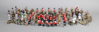 A collection of Britains and other lead and hollow cast figures to include Highlander's Guardsmen, First and Second World War soldiers and a collection of figures with articulated limbs 