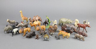 A collection of Britains lead and hollow cast exotic animals (likely from zoo sets) to include elephants, camels, bears, hippo, rhinoceros, zebra, giraffe, kangaroos, polar bears, lions, tapir, gorilla, emu, buffalo, moose, turtle, seal, etc 