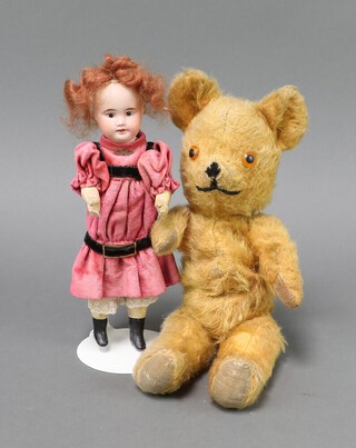 A bisque headed doll marked SFBJ 60 Paris together with an unmarked 1940's teddy bear 