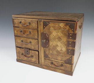 An early 20th Century Japanese parquetry chest with 5 drawers and cupboard door 27cm by 33cm by 24cm