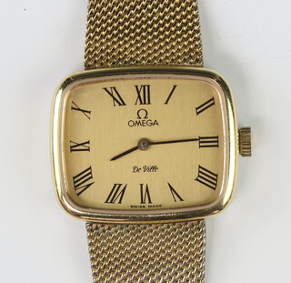 A lady's rectangular gilt metal cased Omega De Ville wristwatch on a gilt bracelet, together with original Omega bracelet  