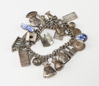 A silver charm bracelet 65 grams 