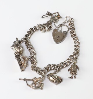 A silver charm bracelet 38.4 grams 