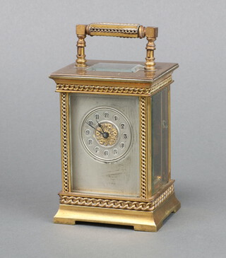 A 19th Century French 8 day carriage timepiece with 3.5cm silvered dial, Arabic numerals, contained in a gilt metal case 10cm x 7cm x 6cm, complete with key 