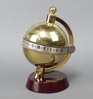 Charles Frodsham of London, a brass and mahogany Globe clock raised on a circular turned mahogany base, serial number 0395/5000 24cm h x 16cm diam. 