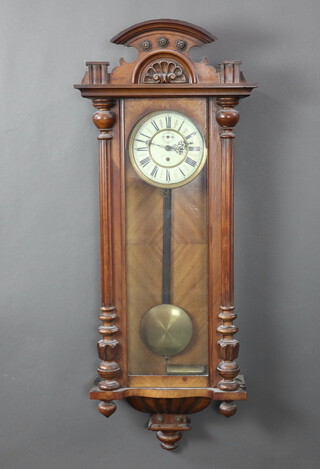 A Vienna style regulator with 8cm enamelled dial, Roman numerals and minute indicator contained in a walnut case complete with pendulum and key 117cm h x 46cm w x 15cm d 