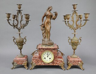 Japy Freres, 19th Century French clock garniture, the striking mantel clock with 8cm enamelled dial, Roman numerals, the back plated marked Japy Freres 253 contained in a stepped pink veined marble case surmounted by a gilt painted spelter figure of a lady "Parfum De Iris" 49cm h x 27cm x 14cm, together with two 5 light candelabrum