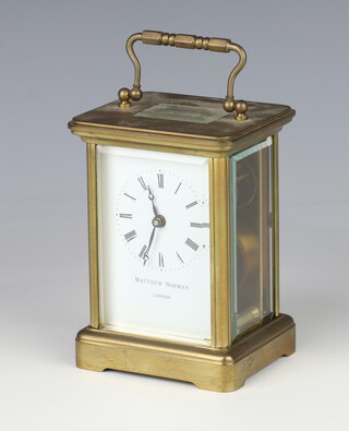 Matthew Norman, a 20th Century carriage timepiece with 6cm enamelled dial, Roman numerals marked Matthew Norman London, contained in a gilt case 11cm x 8cm x 6.5cm 