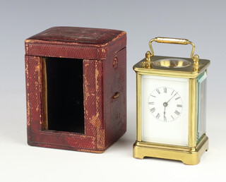 A Waterbury Clock Co. 8 day striking on bell carriage clock with 5cm dial, Roman numerals, contained in a gilt metal case with leather carrying case 11cm x 8cm x 6cm 
