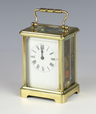 A French 8 day carriage timepiece with 5.5cm enamelled dial Roman numerals, contained in a gilt metal case 11cm x 8cm w x 6cm (no key)