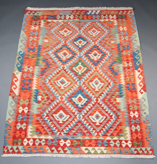 A yellow, green and turquoise ground Chobi Kilim rug with all over geometric designs 196cm x 153cm 