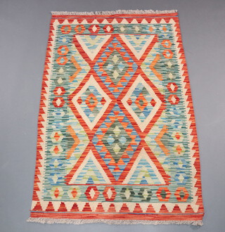 A white, orange and green ground Chobi Kilim rug 123cm x 80cm 