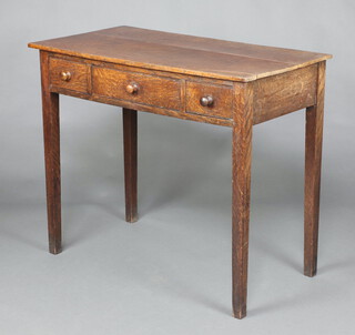 A 19th Century rectangular oak side table fitted 1 long and 2 short drawers, raised on square tapered supports 77cm h x 91cm w x 49cm d 