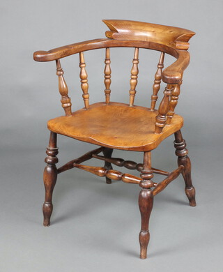 A 19th Century elm smoker's bow elbow chair raised on turned supports with H framed stretcher, 80cm h x 66cm w x 40cm d