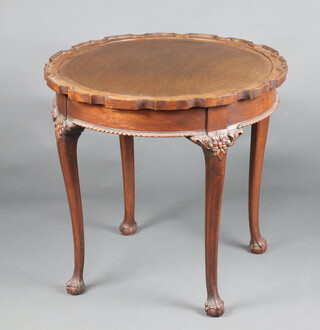 A circular Chippendale style mahogany occasional table with pie crust edge, raised on club supports, ball and claw feet 65cm h x 89cm diam. 