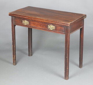 A Georgian rectangular mahogany tea table fitted a drawer, raised on square supports 75cm h x 90cm w x 44cm d 