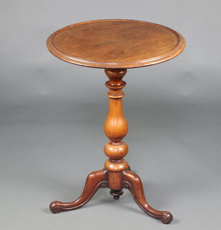 A 19th Century circular mahogany wine table with dish style stop, raised on bulbous turned column and tripod base 72cm h x 53cm diam. 