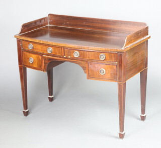 A 19th Century inlaid mahogany bow front dressing table with 3/4 gallery, 2 long drawers above 2 short drawers, raised on square tapered supports, spade feet 75cm h x 107cm w x 50cm d 