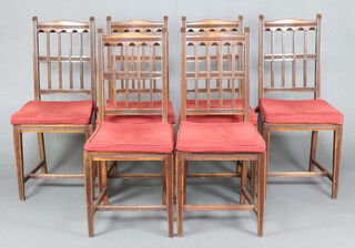 A set of 6 oak Aesthetic movement stick and rail back dining chairs with woven cane drop in seats and red seat swabs, raised on square tapered supports with H framed stretchers 101cm h x 43cm w x 43cm d 