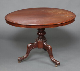 A Victorian circular snap top breakfast table, raised on a pillar and tripod base 71cm h x 102cm diam. 