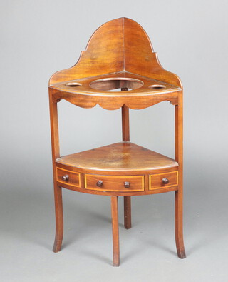 A Georgian inlaid mahogany corner wash stand, the upper section with 3 bowl receptacles, raised on outswept supports 105cm h x 59cm w x 42cm d 