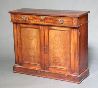 A 19th Century mahogany chiffonier fitted a drawer with brass drop handles above cupboard enclosed by panelled doors raised on a platform base 95cm h x 111cm w x 39cm d 