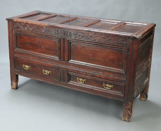 A 17th Century oak mule chest with hinged lid, the foliate carved frieze inscribed AH 1700, the base fitted 2 drawers raised on stile supports. The drawers featuring an internal  sliding bar locking mechanism (bars not present)  82cm h x 145cm w x 54cm d 