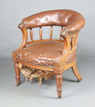 A Victorian mahogany show frame tub back office chair with spindle decoration upholstered in brown material, raised on turned supports 79cm h x 66cm w x 57cm 