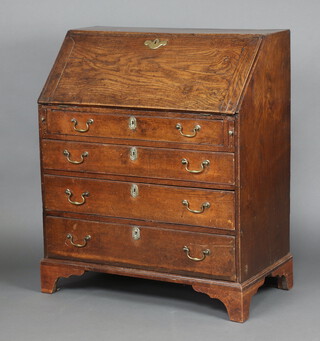 An 18th Century oak bureau, the fall front revealing a stepped interior fitted drawers above 4 drawers with replacement brass swan neck drop handles, raised on bracket feet 102cm h x 86cm w x 46cm d 