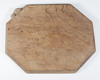 Robert Thompson (Mouseman), an octagonal carved oak cheese/bread board carved a mouse 27cm x 31cm 