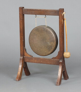 A 1930's oak and metal tea gong complete with beater 69cm h x 44cm x 25cm 