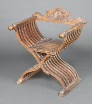 An Italian style carved oak X framed folding armchair 83cm h x 69cm w x 54cm d 