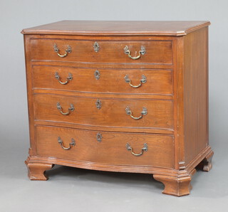 An Edwardian Georgian style chest of serpentine outline of 4 long drawers raised on shaped bracket feet 88cm h x 96cm w x 56cm d 