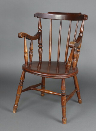 A 19th Century beech and elm Windsor stick and rail back kitchen carver chair with solid seat, raised on turned supports with H framed stretcher 81cm h x 52cm w x 50cm d 